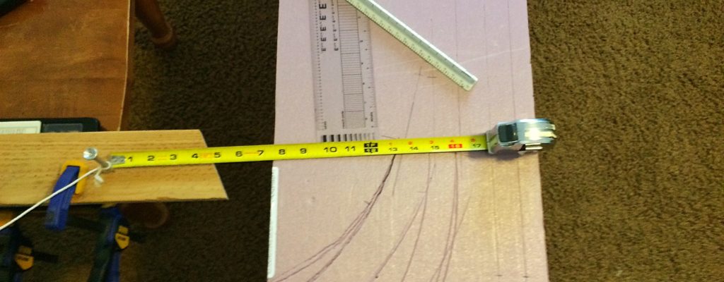 Measuring out the radius for the curved sections of track.